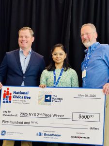 Anika Das pictured with her check